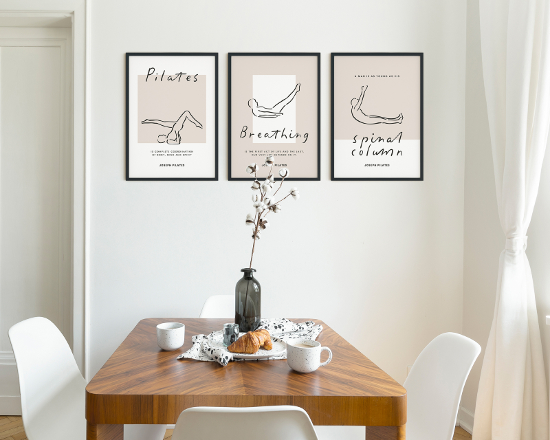 White chairs at wooden table in minimal dining room interior with door and poster. Real photo